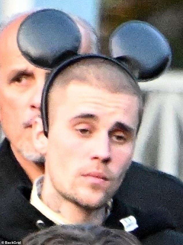 Its slogan is 'the happiest place on earth,' but even Disneyland didn't seem able to put a smile on Justin Bieber's face