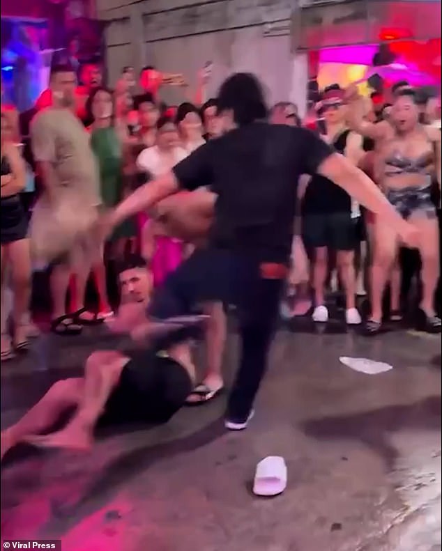 After the punch knocked him to the ground the dazed man was kicked by the bouncer