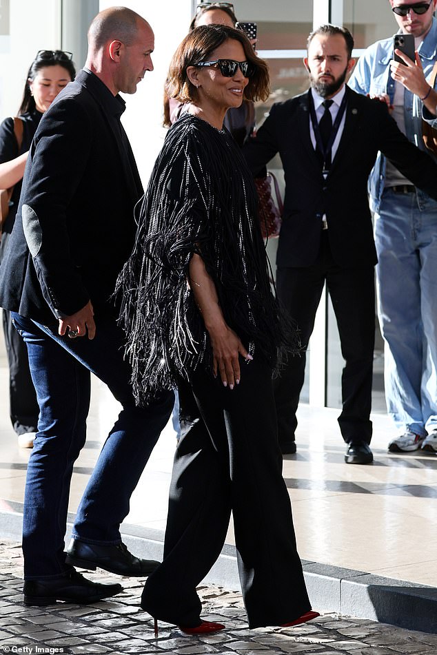 Halle opted for the eye-catching tunic which was adorned with silver sequins as she made her way into the event