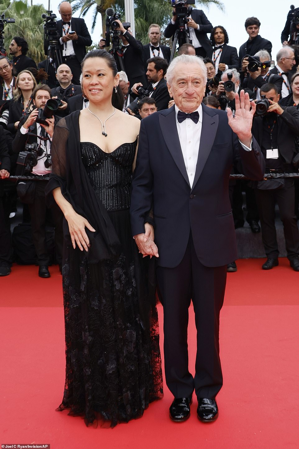 Robert De Niro looked dapper in black as he attended the opening ceremony with his partner Tiffany Chen