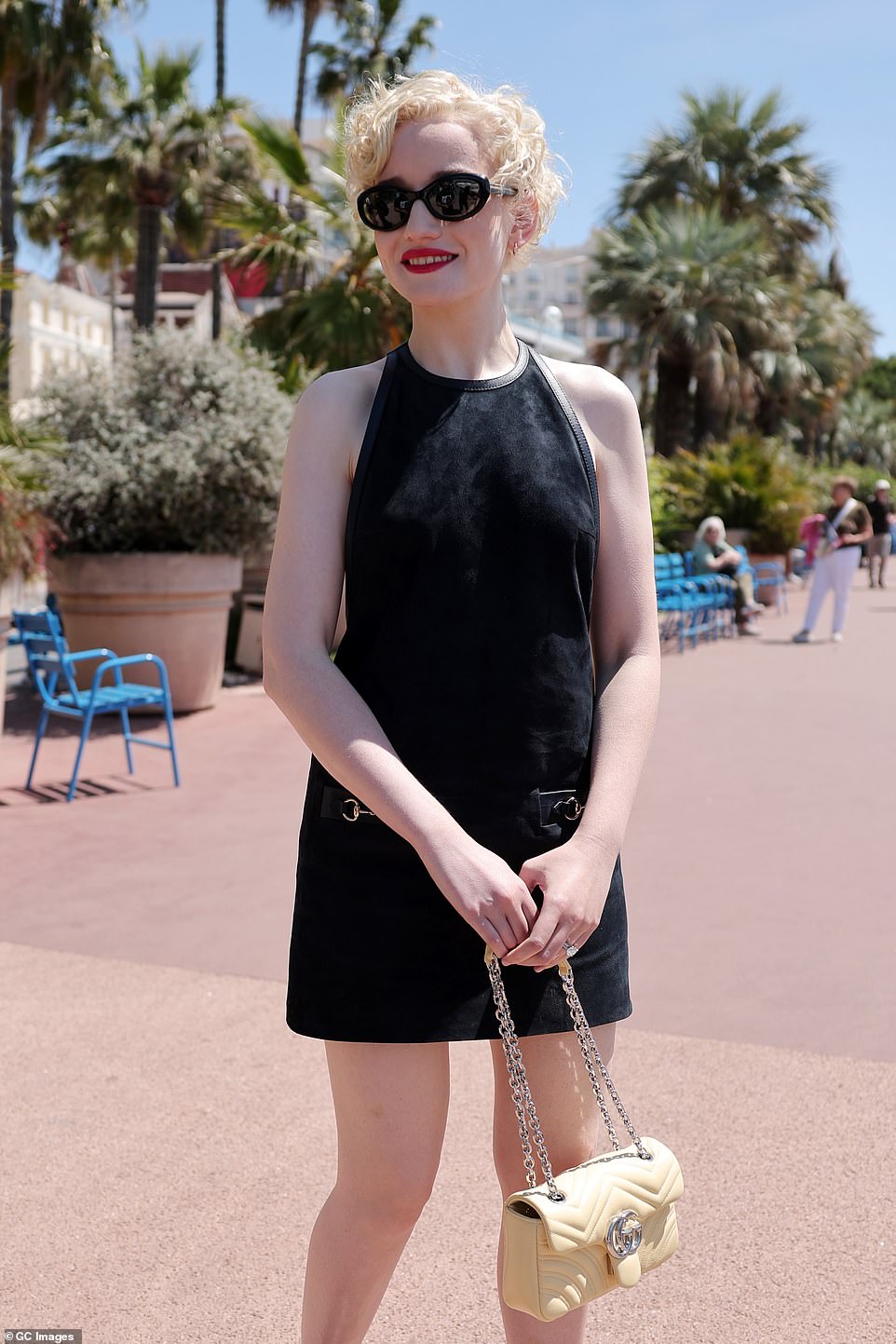 Julia was beaming with her bright red lipstick on show as she carried around a cream leather Gucci handbag