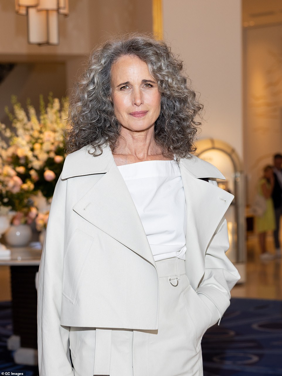 She donned a light grey suede oversized biker jacket and knee-length skirt