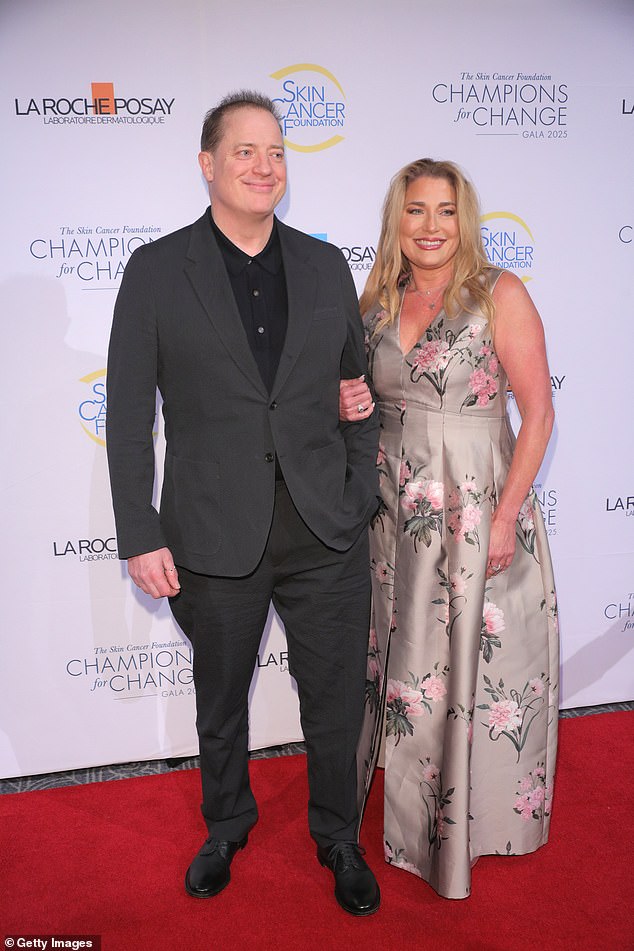 The Oscar winner , 56, cut a dashing figure in a sharp navy blue suit as he hit the red carpet with his girlfriend Jeanne Moore