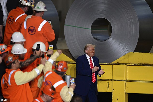 President Donald Trump is cheered by U.S. Steel workers as he arrived at the Irvin Works Friday evening in West Mifflin, Pennsylvania