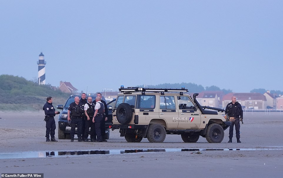 Police officers in France were accused of standing and watching without intervening, with one even spotted appearing to take photographs on his phone