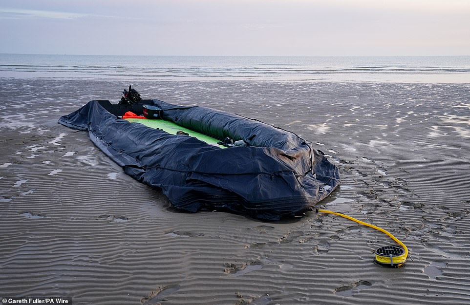 The remains of a small boat on the beach in Gravelines, France, following an unsuccessful attempt by people thought to be migrants to reach the UK