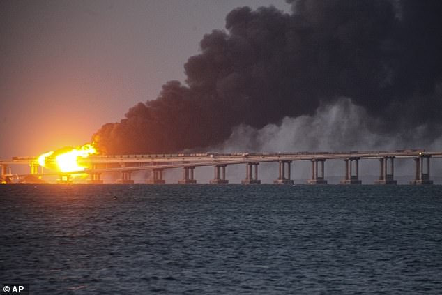 Flames and smoke rise from a bridge connecting Crimea and Russia in Kerch, on the Crimean peninsula, Oct. 8, 2022