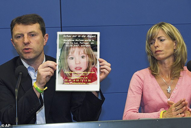 Gerry, left, and Kate McCann, parents of four-year old Madeleine McCann, present a picture of their daughter during a press conference in Berlin, Wednesday, June 6, 2007