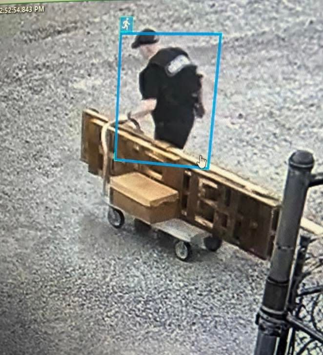 Grant Hardin, a former police chief serving decades-long prison sentences for murder and rape, is seen escaping in a makeshift Arkansas Department of Corrections uniform and pushing a cart loaded with materials.