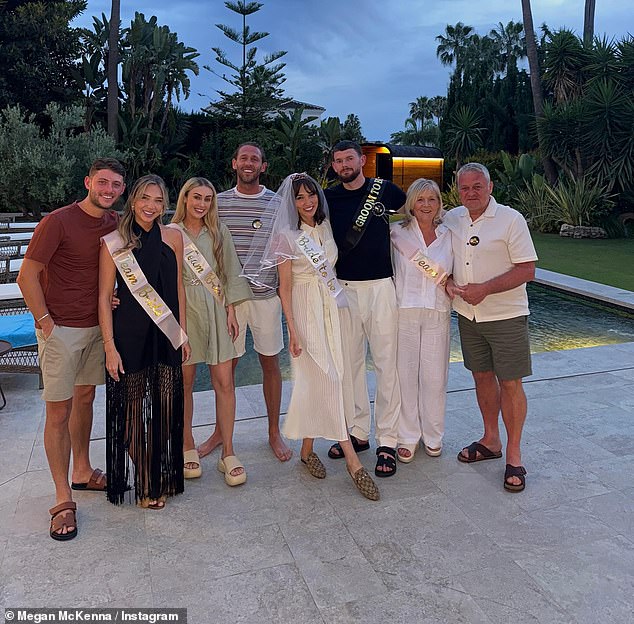 Oliver wore a black T-shirt with a pair of smart white linen trousers to celebrate with friends and family during their holiday
