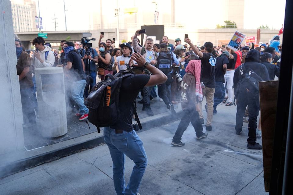 Jae C. Hong/AP - PHOTO: People react as a Department of Homeland Security officer shoots pepper balls during a protest after federal immigration authorities conducted an operation, on June 6, 2025, in Los Angeles.