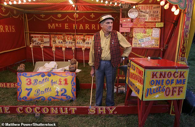 Albert Harris stands at his traditional coconut shy at the Midsummer Fair in Cambridge in 2007