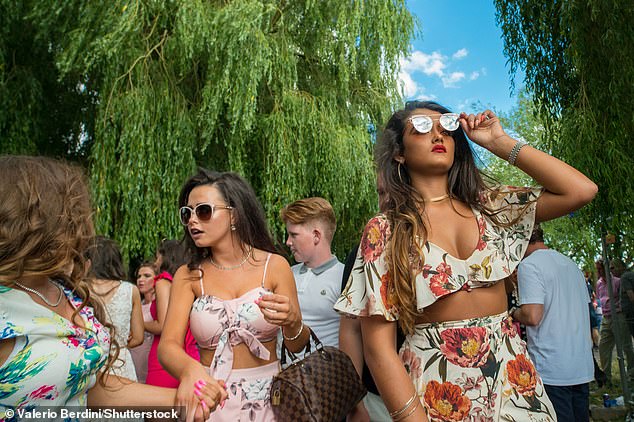 People attend the Midsummer Fair in Cambridge, a traveller-run event dating back to 1211