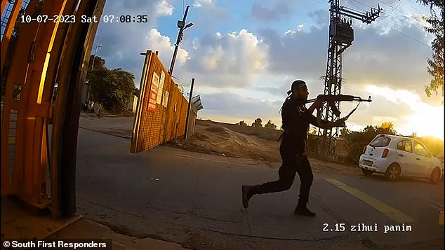 A Hamas gunman is seen storming into an Israeli kibbutz on October 7