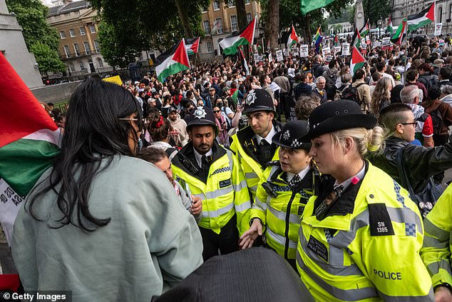 Police argue with protestors demonstrating in support of the Freedom Flotilla on June 9, 2025 in London, England