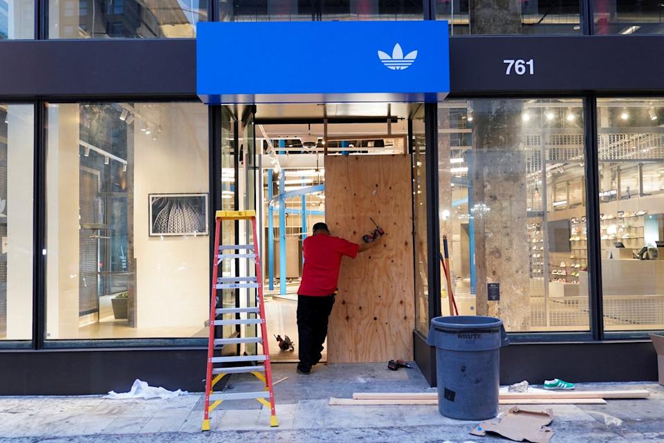 An Adidas store was among several burglarized on Monday evening as protests continued for a fourth day (REUTERS)