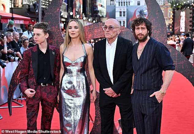 28 Years Later is the sequel to Danny's 2002 original film, which sees civilisation fall to a zombie outbreak (pictured: Alfie Williams, Jodie, director Danny and Aaron)