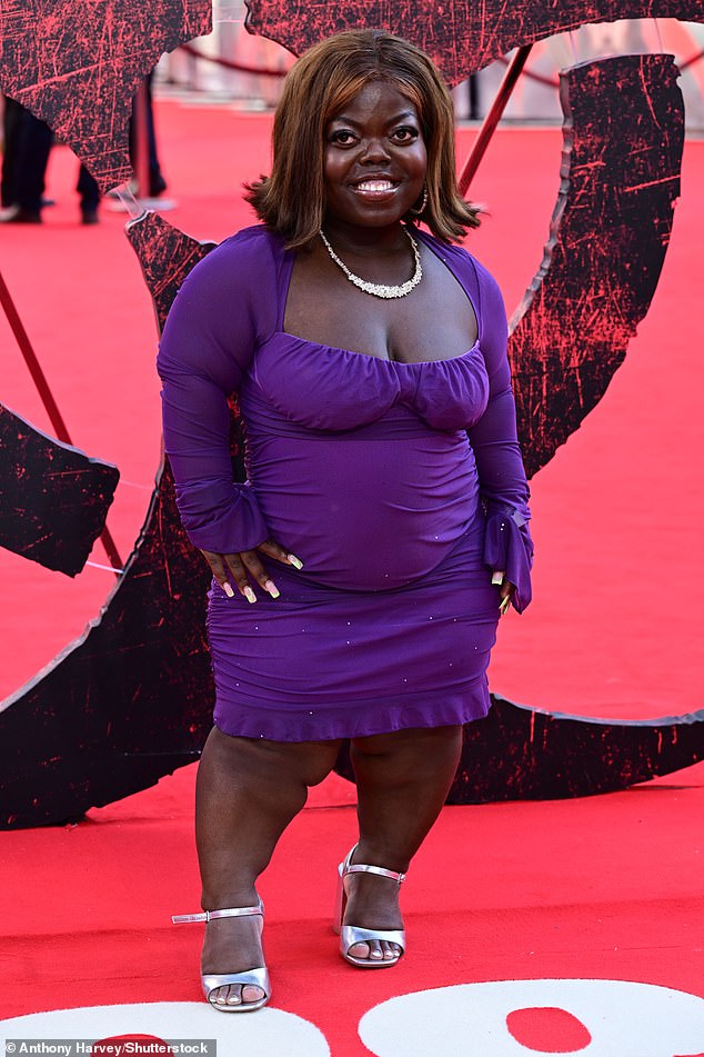 Fats Timbo posed for snaps in an eye-catching purple dress, teamed with silver heels