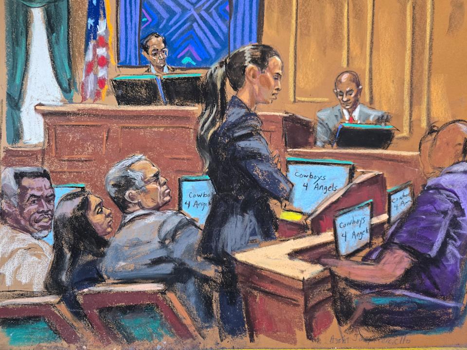 Defense lawyer Teny Geragos cross-examines Joseph Cerciello as Combs smiles in court. (Jane Rosenberg/Reuters)