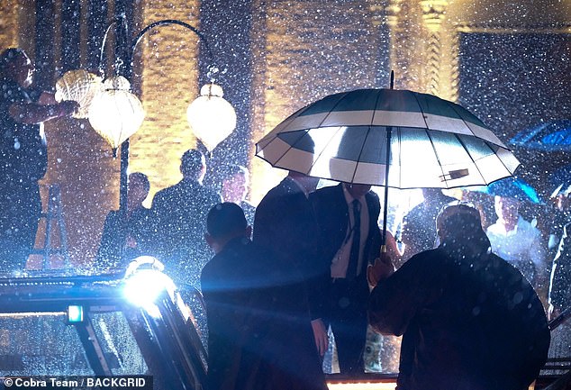 The strong gusts of winds whipped table cloths away and sent waiters scurrying for umbrellas to protect the VIP guests