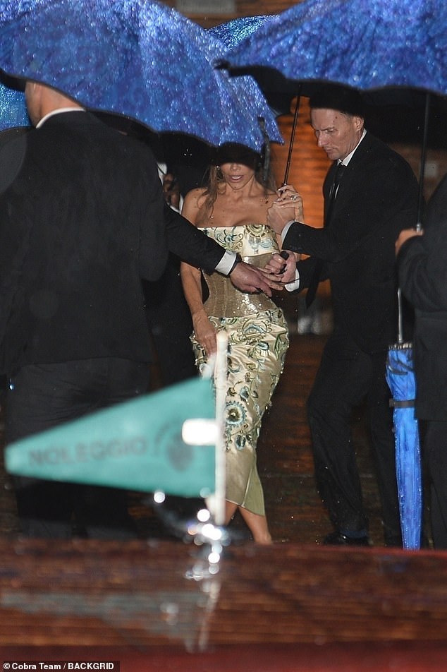 The TV personality, 55, had on a striking off-the-shoulder dress with a dramatic gold corset cinching in her already tiny waist