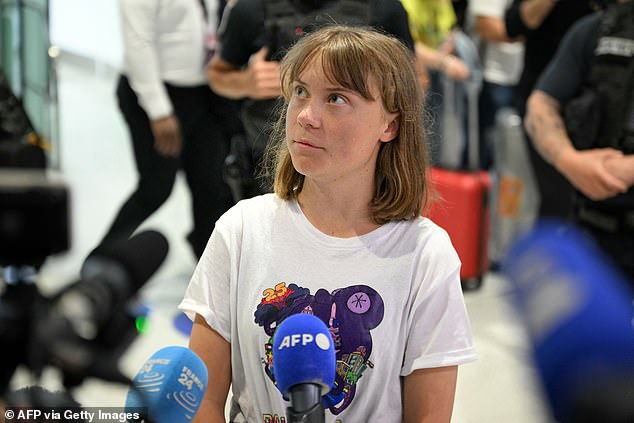 Greta Thunberg talks to journalists upon her arrival to Roissy-Charles de Gaulle Airport, as she left Israel on a flight to Sweden via France, after she was detained along with other activists aboard a Gaza-bound aid boat, on June 10, 2025