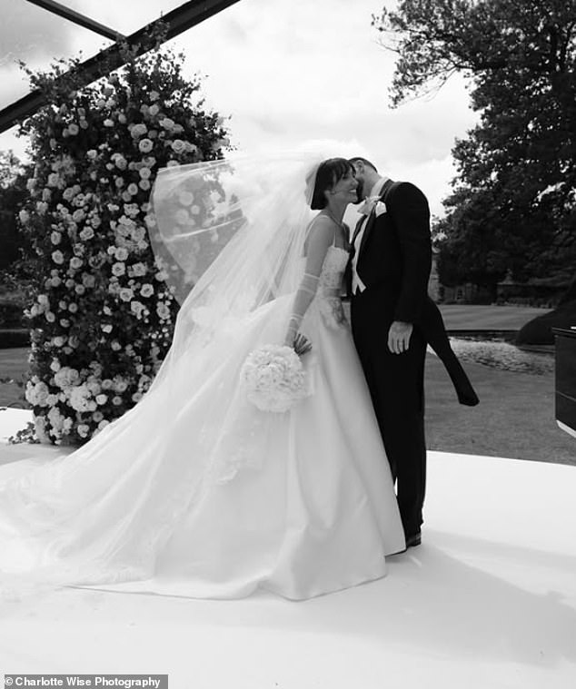 The former TOWIE star, 32, looked incredible on the day in a flowing white gown while footballer Oliver, 27, donned a black tuxedo