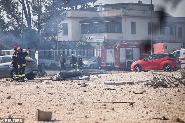 Emergency services personnel work at the scene where a gas station exploded on the outskirts of Rome, Italy, July 4, 2025