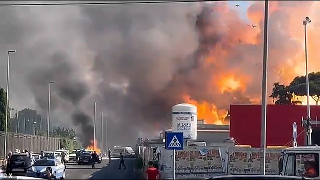Fires are seen raging at the petrol station this morning in Rome
