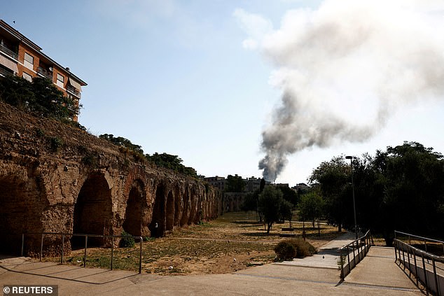 A huge cloud of smoke rises after a gas station exploded on the outskirts of Rome, Italy July 4, 2025