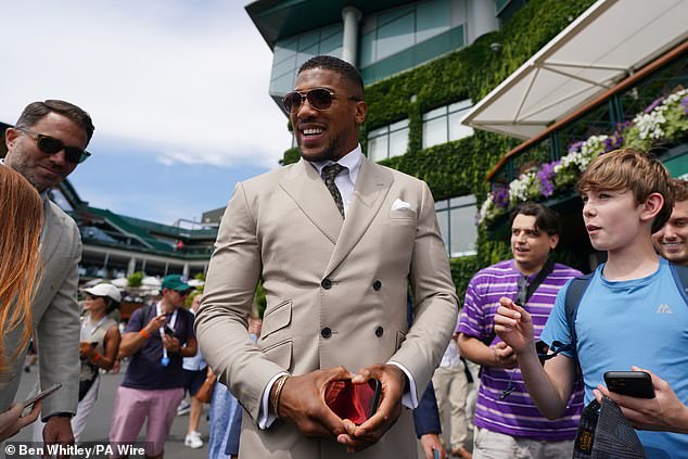Despite donning a pair of shades the former world heavyweight championship didn't go unnoticed by fans