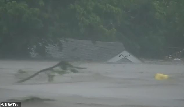 KERR COUNTY, TX: The rushing Guadalupe River carries debris downstream as heavy rains flood the river banks and cause raging floods