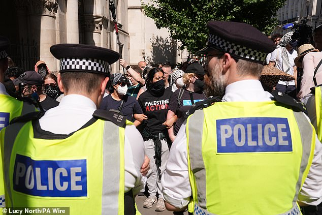 Protesters having a demonstration after the decision by the High Court