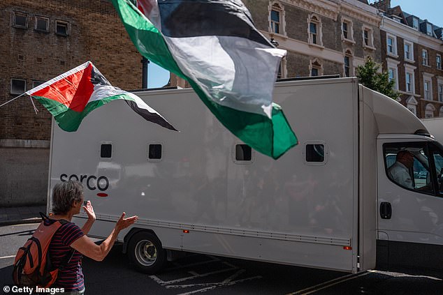 The protesters supporting the activists clapped and cheered as a prison van, believed to be holding the accused, arrived at court on July 3