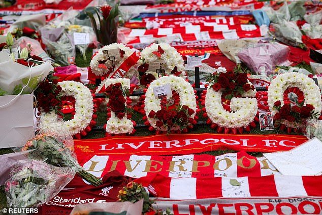 Tributes included wreaths spelling out his name, Liverpool scarfs, flags and tops