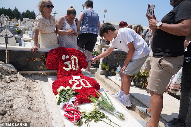 Floral tributes bearing the shirt numbers of Diogo Jota and his brother Andre Silva were placed on their graves in a cemetery in Gondomar