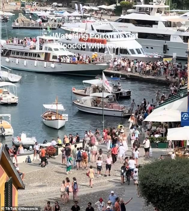 Another TikToker posted a clip of a busy street in Portofino and simply wrote, 'watching Portofino get flooded with tourists'
