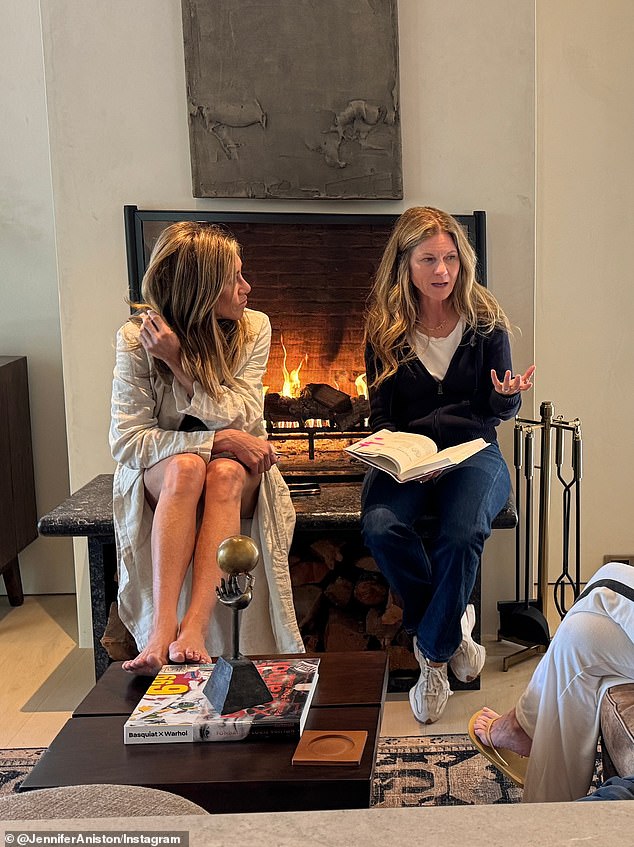 Seen with her producing partner Kristin Hahn by her fireplace