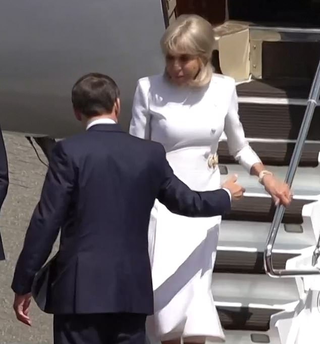 Brigitte did not accept her husband's offer of a helping hand as she walked down the steps