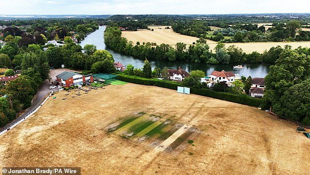 Dried grounds surrounds pitches at Maidenhead and Bray Cricket Club in Berkshire on Tuesday