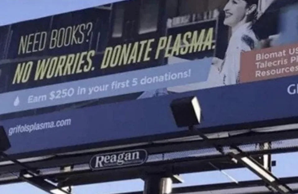 Billboard promotes plasma donation, offering $250 for the first five donations. Slogan: "Need books? No worries. Donate plasma"