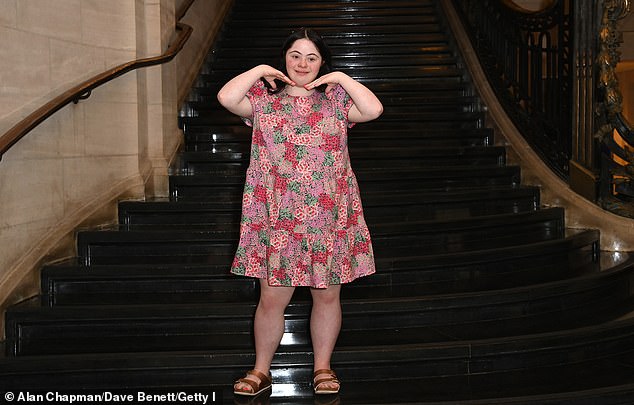 Ellie is a model, actress and influencer who became the first model with Down syndrome to grace the cover of British Vogue (pictured on the catwalk in June 2025)