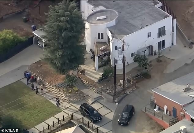 While no arrests have been made, the Los Angeles Times reported that the federal raid on a Tujunga, California property (pictured) tied to Shinn is part of an ongoing investigation