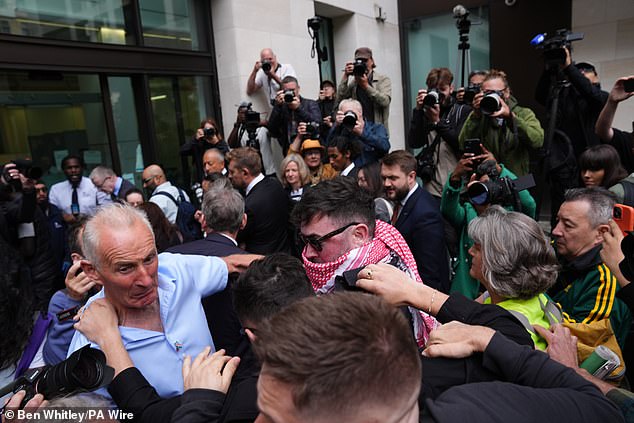 Scores of fans, journalists and reporters charged the musicians as they entered the court