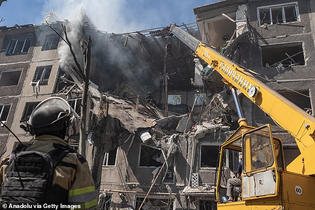 Ukrainian firefighters search for survivors after a Russian air strike on a residential building after a Russian airstrike in Kostiantynivka, Ukraine on August 19, 2025