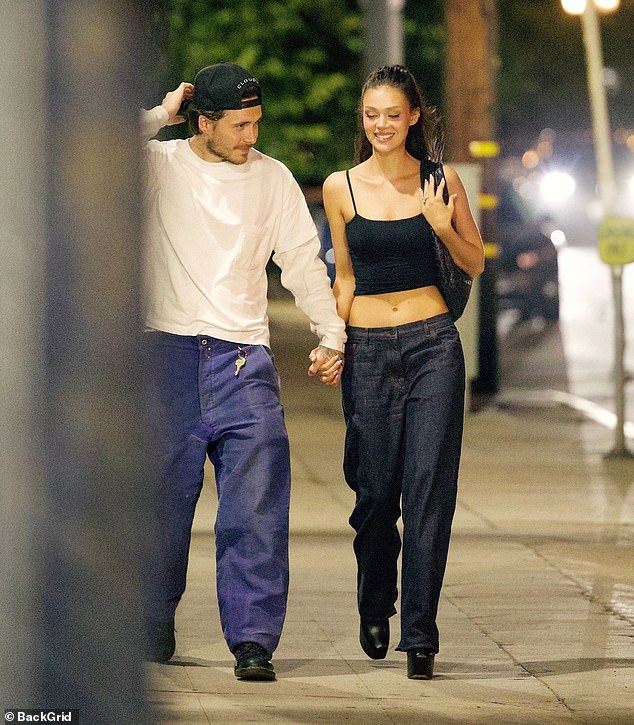 The eldest son of David and Victoria Beckham , 26, and his heiress wife, 30, held hands as they headed to the Italian restaurant
