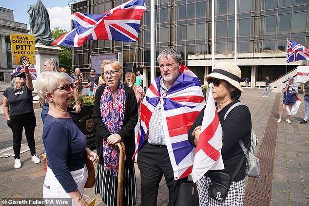 Protesters carrying Union flags and St George's Crosses in Portsmouth today