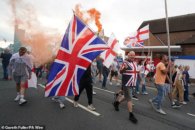 Demonstrators lit flares and marched through the streets of Epping on Sunday afternoon