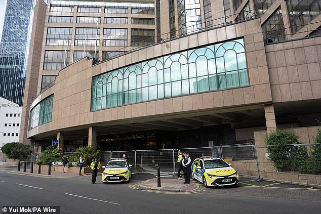 At Canary Wharf, police officers stood at the entrance to the Britannia Hotel while security guards could also be seen standing behind full length barriers that blocked off the entrance way