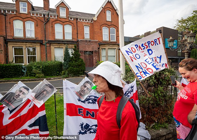 Demonstrators blowing whistles and waving flags in Fallowfield, Manchester on Sunday